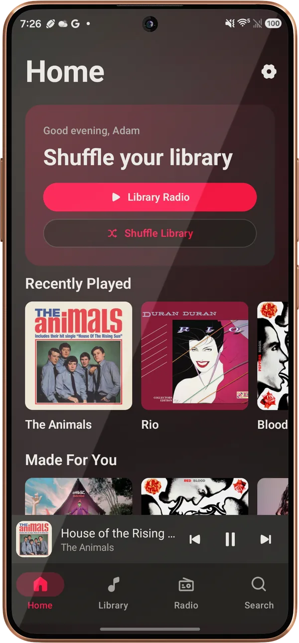 Lagu’s Home screen on an Android phone: a Good evening greeting reading Shuffle your library, Library Radio and Shuffle Library buttons, a Recently Played row, the start of Made For You, and the mini-player and navigation bar.