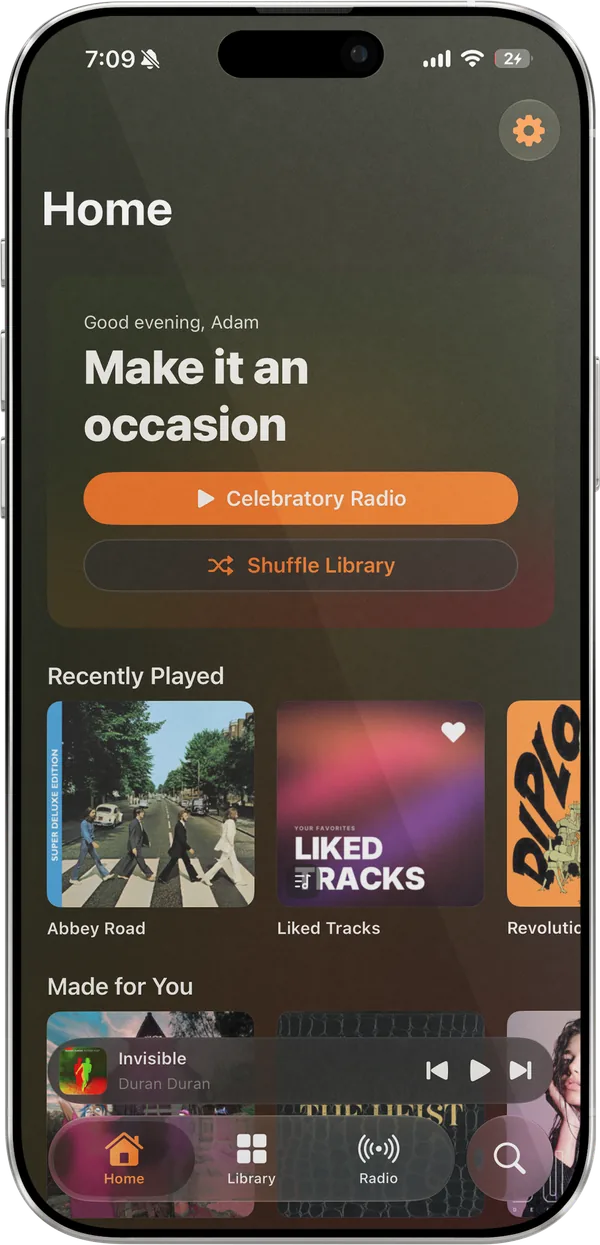 Lagu’s Home tab on iPhone: a Good evening greeting reading Make it an occasion, Celebratory Radio and Shuffle Library buttons, a Recently Played row, the start of Made for You, and the mini-player and tab bar along the bottom.