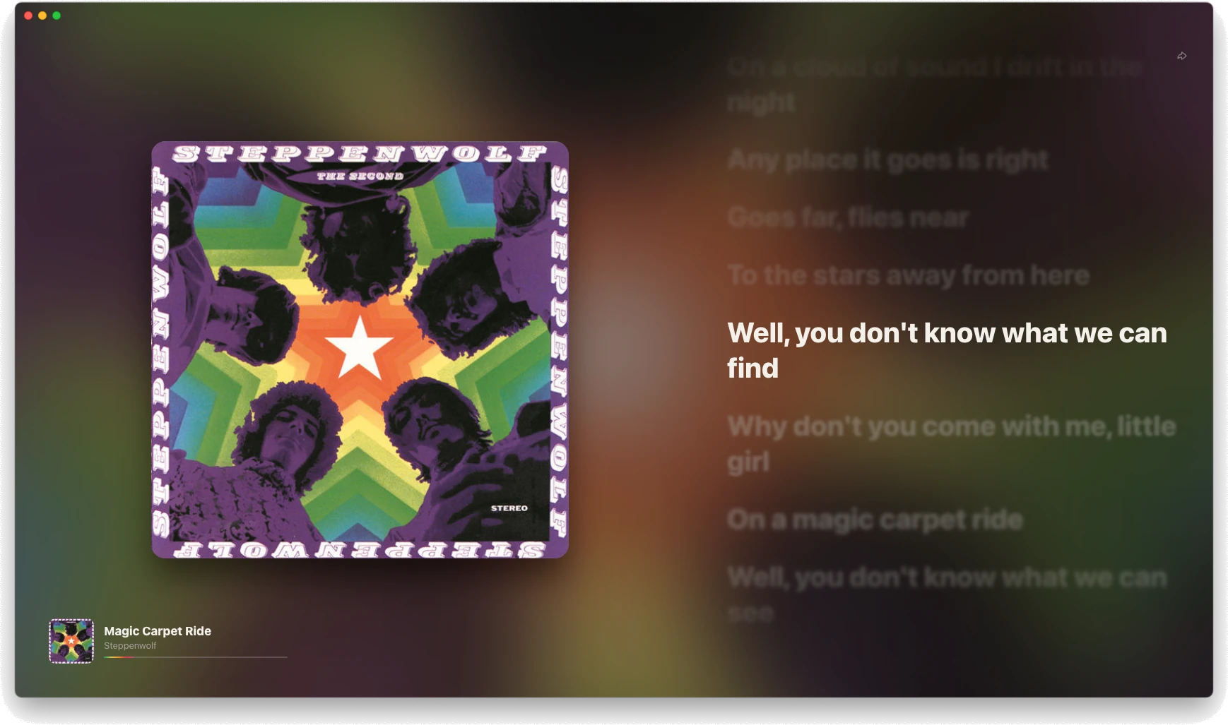 Lagu fullscreen on macOS for Steppenwolf’s Magic Carpet Ride: the cover of The Second over a blurred background in its colors, synced lyrics down the right-hand side with the current line in white and the rest dimmed, and the cover, title, and artist in the bottom left corner.