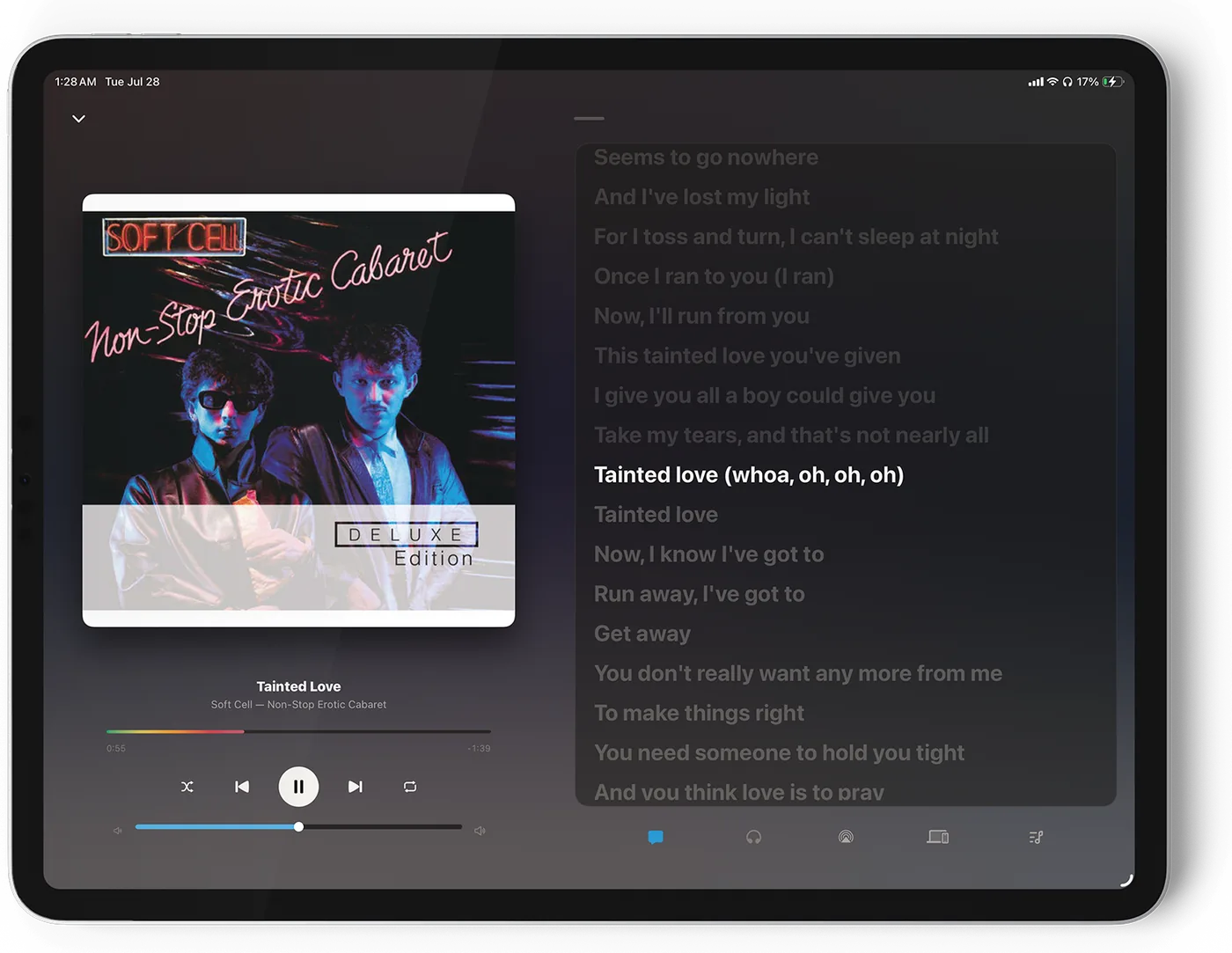 Lagu on iPad in landscape: album artwork and transport controls on the left, synced lyrics on the right with the current line highlighted and the rest dimmed.